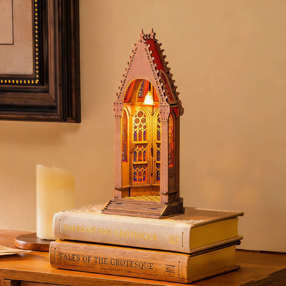 Rolife Geometric Cathedral TGA03 displayed as a glowing cathedral night light on books
