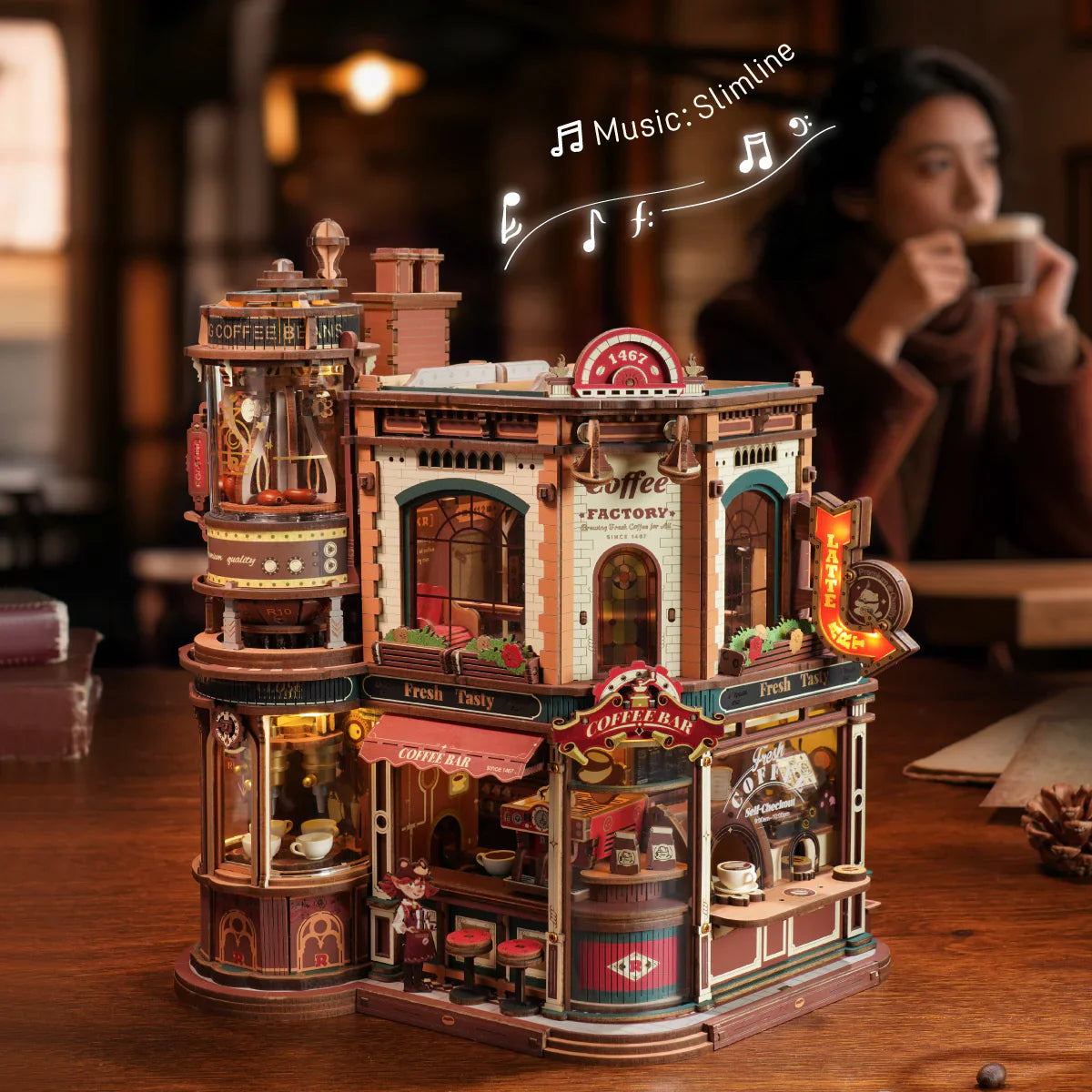 Detailed model of a coffee factory on a table with blurred background