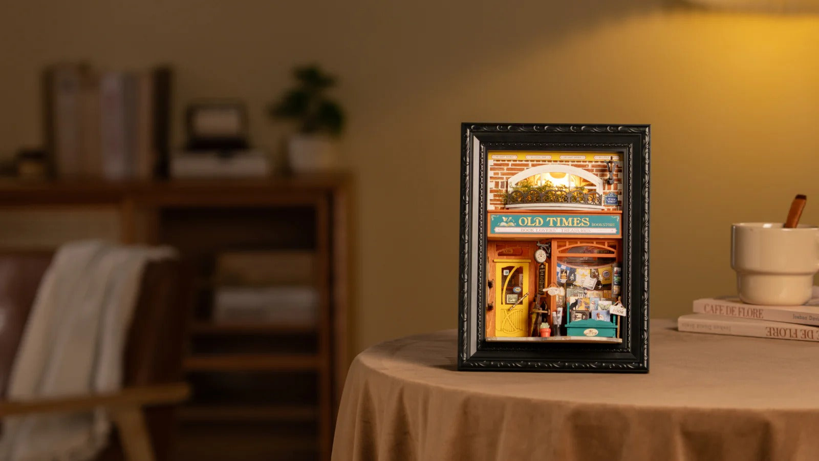 Rolife Old Times Bookstore DP004 illuminated story frame displayed on a warm tabletop scene