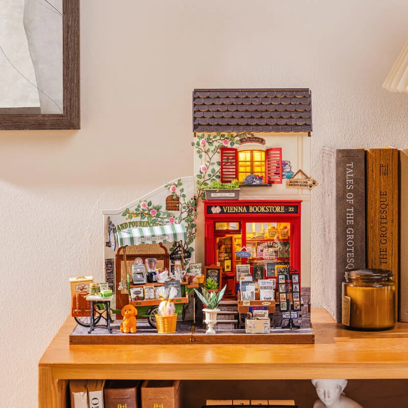 Rolife Vienna Bookstore DG183 shown with optional Aromatic Coffee Cart for a miniature street display