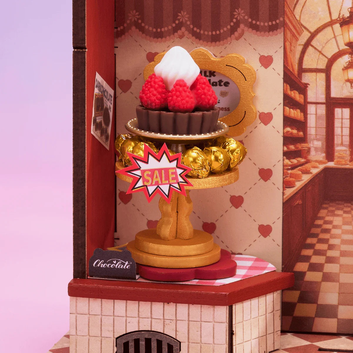 Rolife Sweet Chocolate Shop DS046 close-up of dessert stand with cake and gold chocolate decorations