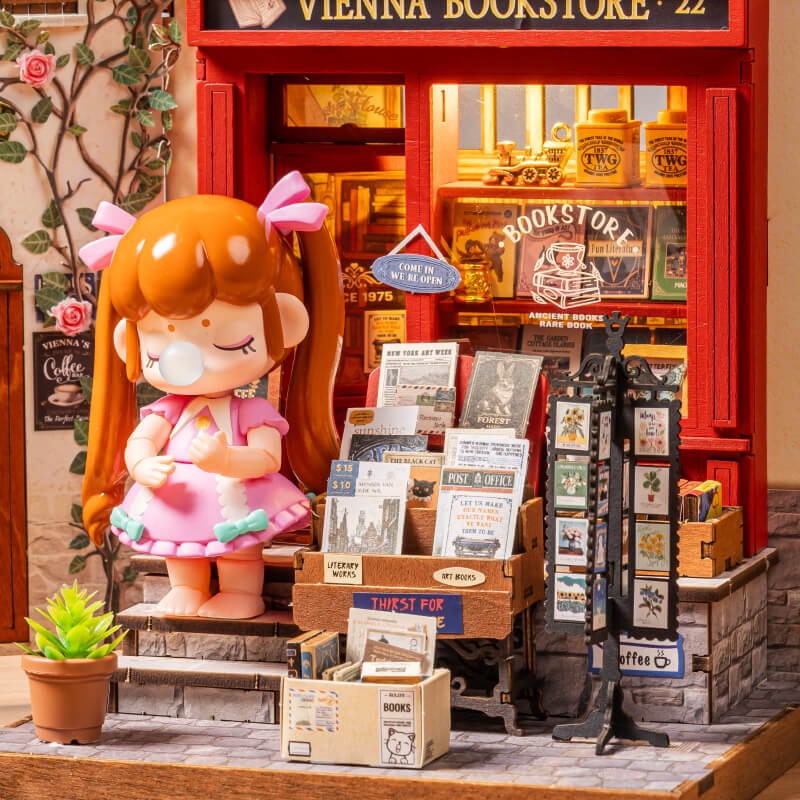 Close-up of Rolife Vienna Bookstore DG183 storefront books, accessories and optional Nanci figure display idea