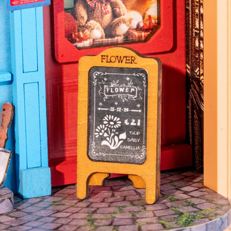 Rolife Daily Fresh Flower DP003 close-up of miniature chalkboard sign beside the red cabinet and shop entrance
