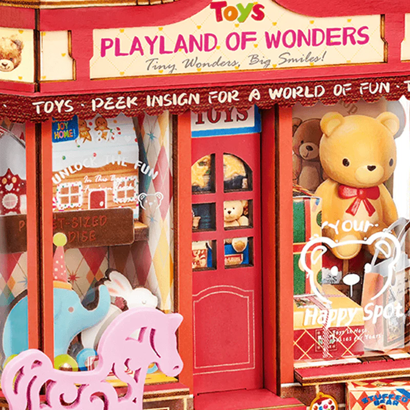 Close-up of Rolife Whimsy Toy Shop DS044 storefront, toy displays, bear window graphic, and red door.