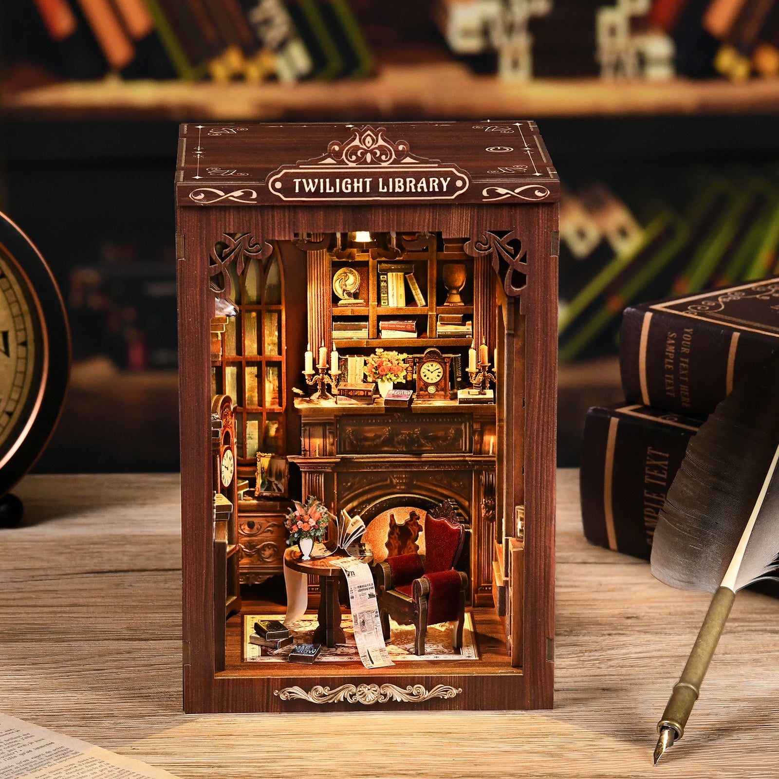 Twilight Library miniature library model displayed on a desk with warm LED lighting