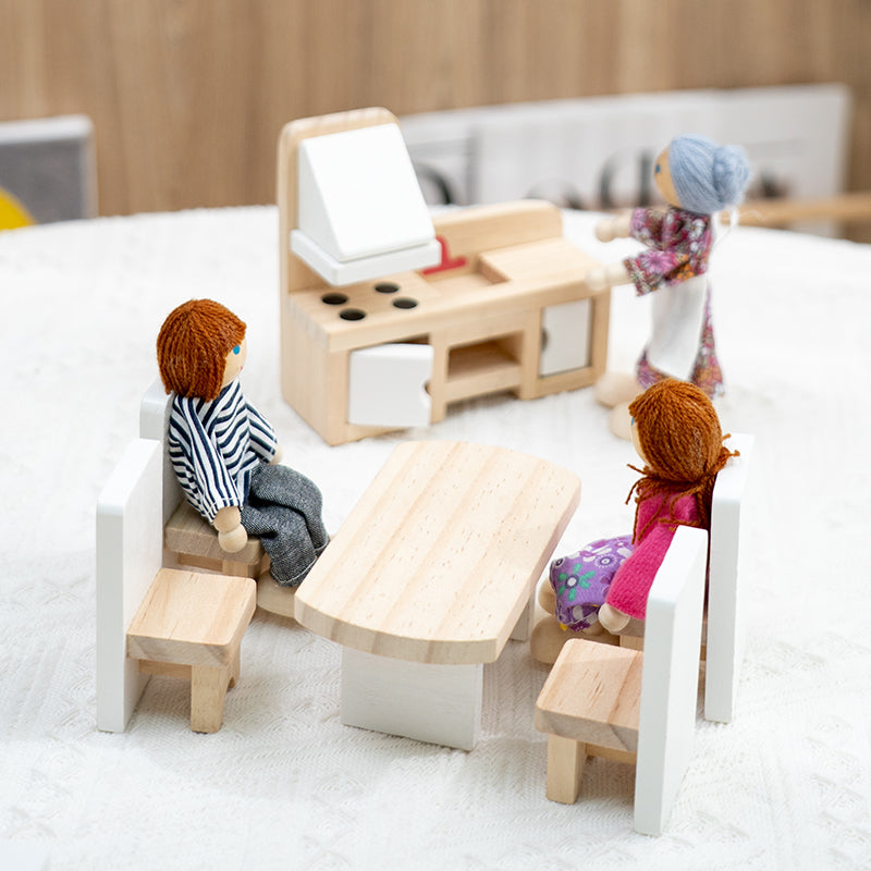Close-up of wooden dollhouse kitchen bench and dining table scene